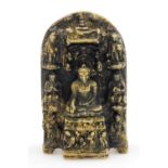 An Indian bronze Hindu shrine, of domed form cast centrally with Buddha seated on a lotus leaf,