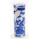 A Chinese blue and white porcelain cylinder vase, decorated with bird perched on a peony branch