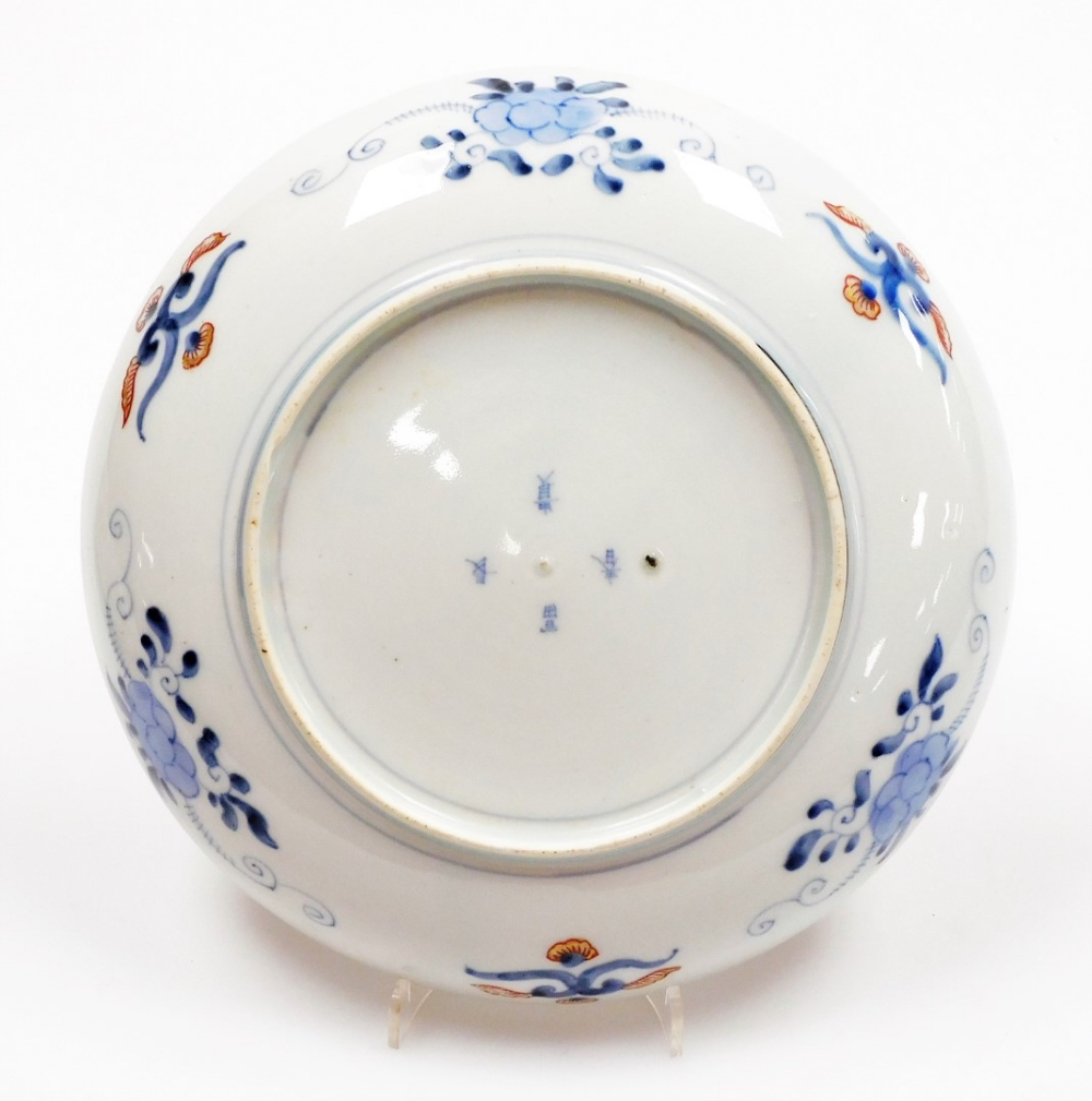 A set of four Japanese Imari porcelain plates, decorated with figures among bamboo and prunus, - Image 7 of 9