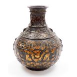 A 20thC metal vase, with compressed cylindrical stem, studded and raised with stylised animals,