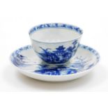 A Nanking cargo blue and white tea bowl and saucer decorated with landscapes, bearing Christie's lot