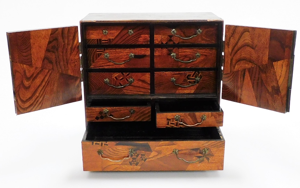 A Japanese Meiji period parquetry and lacquer table cabinet, with two doors opening to reveal six - Image 5 of 7