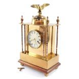 A Hamburg American Clock Company late 19thC brass table clock, circular dial bearing Roman numerals,