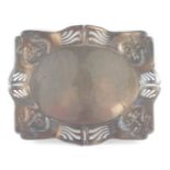 A Continental Art Nouveau pewter tray, of rectangular serpentine form, embossed with trailing