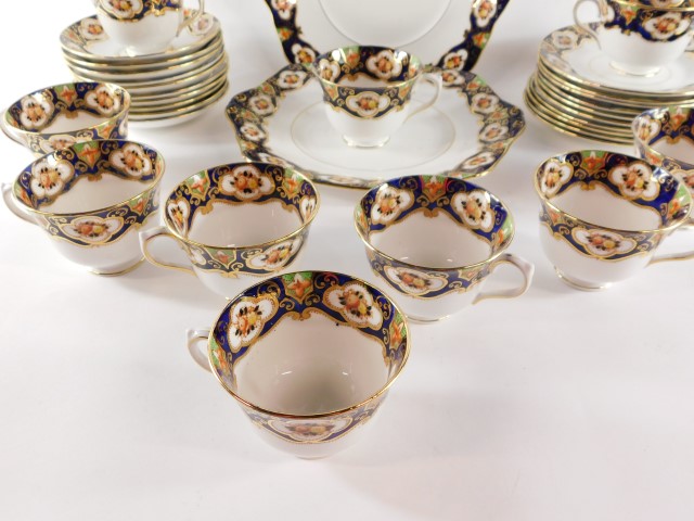 A Royal Albert Crown China late 19thC porcelain tea service, decorated with reserves of flowers - Image 5 of 6