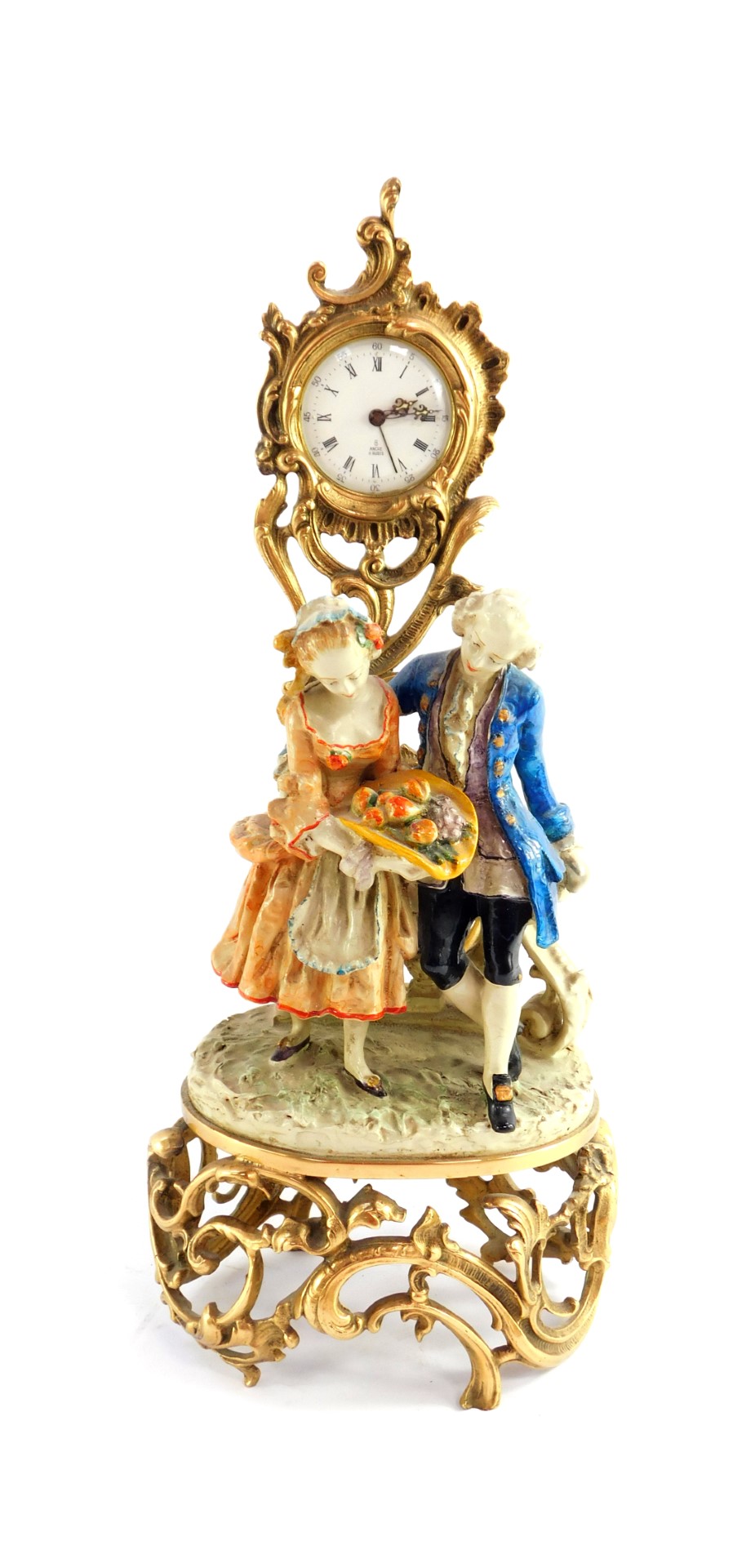 A French 20thC figural mantel clock, enamel circular dial bearing Roman and Arabic numerals,