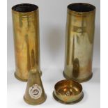 A German WWI shell case 1917, decorated with a lady, 'Peronne', an OKT 1917 shell case ashtray, a