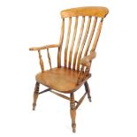 A Victorian beech oak and elm lath back kitchen chair, with solid saddle seat, raised on turned