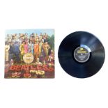 A Beatles Sgt Pepper's Lonely Hearts Club Band vinyl LP album, PMC7027, with card insert, 1967.