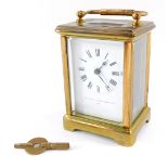 A French early 20thC brass cased carriage clock, The Jewellers & Silversmiths Company, Paris., the