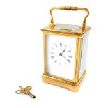 A French brass carriage clock, rectangular enamel dial bearing Roman numerals, twin barrel movement,