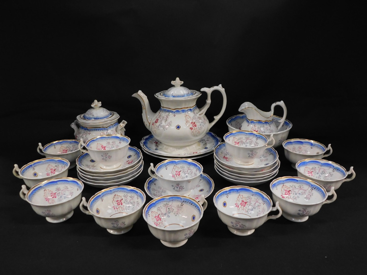 A Staffordshire early 19thC pottery tea service, painted with flowers, pattern no 17., comprising