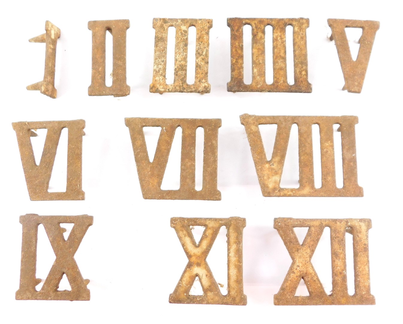 A set of eleven cast iron Roman numerals, I - XII, X lacking.
