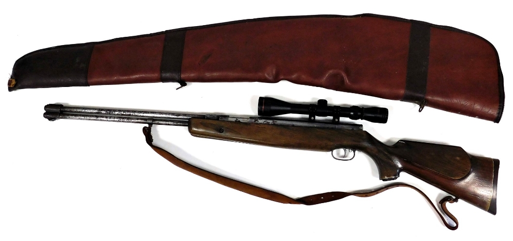 A Weihrach .22 under lever air rifle with 3-9 x 40 telescopic sights, 114cm long, with leather slip