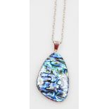 A silver mother of pearl pendant and chain, the oblong shaped pendant in a blue purple,