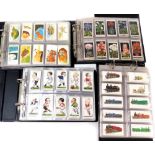 Four albums of cigarette cards, to include varying subjects such as trains, flowers, footballers, co