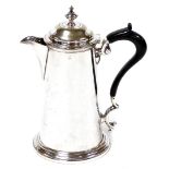 A late 19thC silver plated coffee pot, with a turned hardwood handle, on a shaped body on ribbed foo