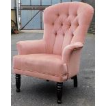 A Victorian style button back chair, in upholstered fabric, on turned mahogany legs, with a shield d