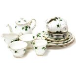 A Colclough china part tea service, comprising teapot, milk jug, two sugar bowls, five cups, six sau