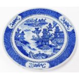 An early 20thC Chinese charger, the borders with blue and white decoration with trees and buildings,