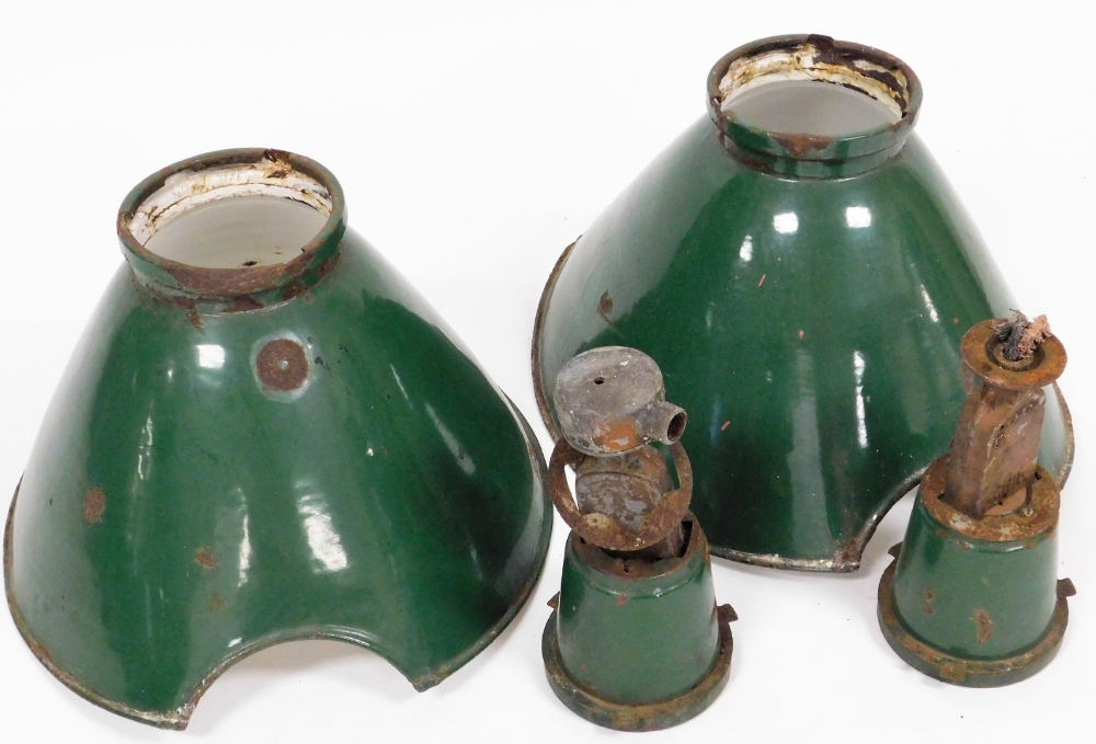 Two industrial light shades, each of domed design with green painted finish on hanging clasp, 50cm w