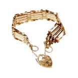 A 9ct gold gate bracelet, the five row design bracelet, with a heart shaped padlock, and safety chai