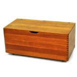 A teak storage basket, with inner removable box section, of castors, 36cm high, 80cm wide, 39cm deep