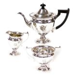 A late 19thC silver plated three piece tea service, comprising tea pot, milk jug and sugar bowl, the