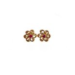 A pair of 9ct gold floral earrings, each with central garnet, with a floral scroll decoration border