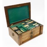 A cased canteen of silver plated Walker and Hall cutlery, the oak case opening to reveal Walker and