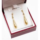 A pair of 9ct gold drop earrings, each of shaped drop design, on single stem back with butterfly bac