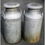 Two aluminium milk churns, stamped Leicester Co-Operative, 72cm high.