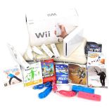 A Wii games console, various controller accessories, nunchuck, variety of games, etc. (a quantity) B