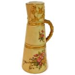 A Royal Worcester blush ivory jug, decorated with sprays of flowers, and a gilt handle, with purple