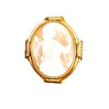 A late 19thC shell cameo brooch, the oval brooch depicting a maiden picking berries, in a gilt metal