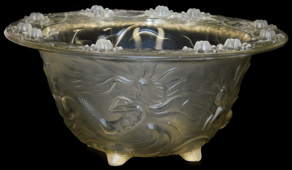 A large art glass bowl, in the Lalique style, depicting mermaids and water lilies, on a four foot st