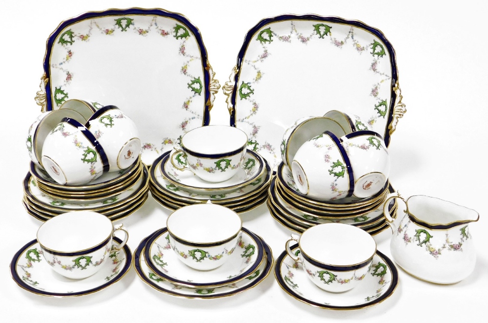 A Royal Crown Derby part tea and dinner service, comprising of two cake plates, milk jug, twelve tea