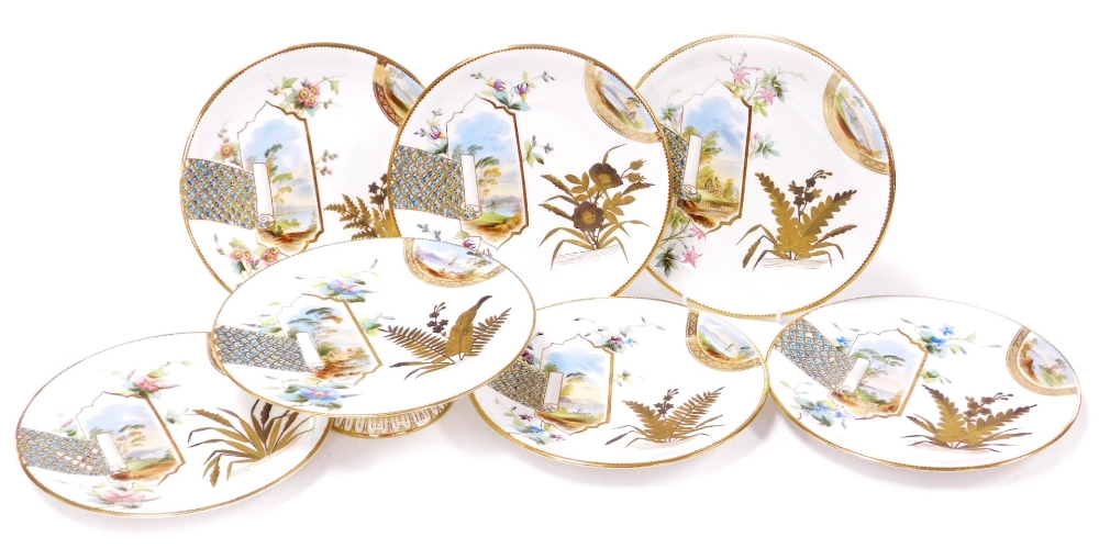 A group of late 19thC porcelain plates, each decorated with embellished scroll panels, with gilt dec