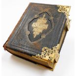 A mid 19thC leather bound illustrated Holy Bible, with various coloured book plates, references and