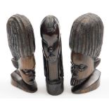 Tribal Art. Three carved wooden tribal figures, each depicting male heads, 21cm, 22cm and 21cm. (3)