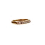 A 9ct gold half hoop eternity ring, set with seven tiny white stones, makers stamp SDJ, Birmingham i