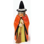 A Royal Worcester witch candle snuffer, depicting a witch in red gown with broom, with purple Royal