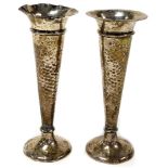 Two George V silver bud vases, one with pitted body and weighted base, London 1925, and another with