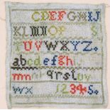 An early 20thC needlework sampler, depicting the alphabet and numbers one to five, 14cm x 14cm, in a