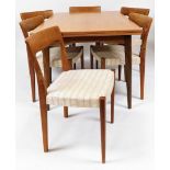 A teak extending 1960's/70's dining table, with a set of six associated chairs later upholstered, 66