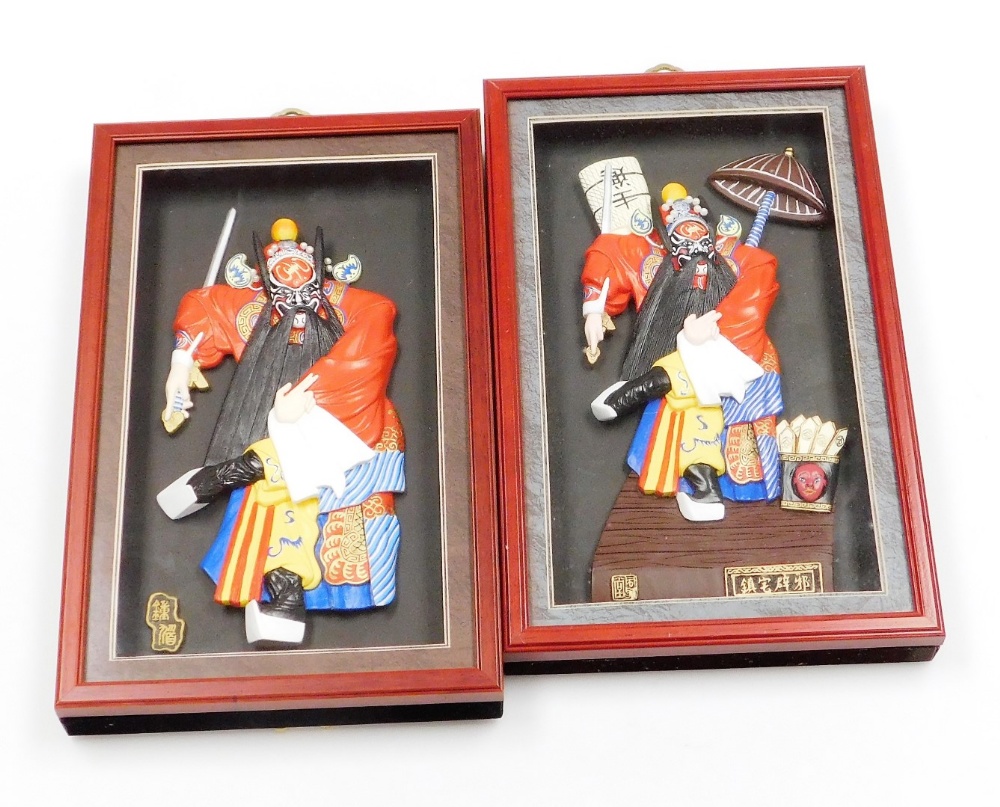 A pair of modern Chinese wall art pictures, each depicting characters from the Peking Opera, in rais