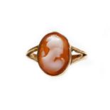 A 9ct gold cameo dress ring, the small oval cameo depicting a maiden, in rub over border, 11mm x 9mm