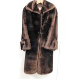 A Gonell brown faux fur coat, with a brown material lining.