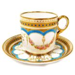 An early 20thC porcelain cup and saucer, decorated with gilt banding, blue enamel and pink roses, nu