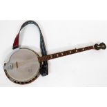 A German banjo, with mother of pearl inlaid band and pegs, 97cm long, with Made In German Democratic